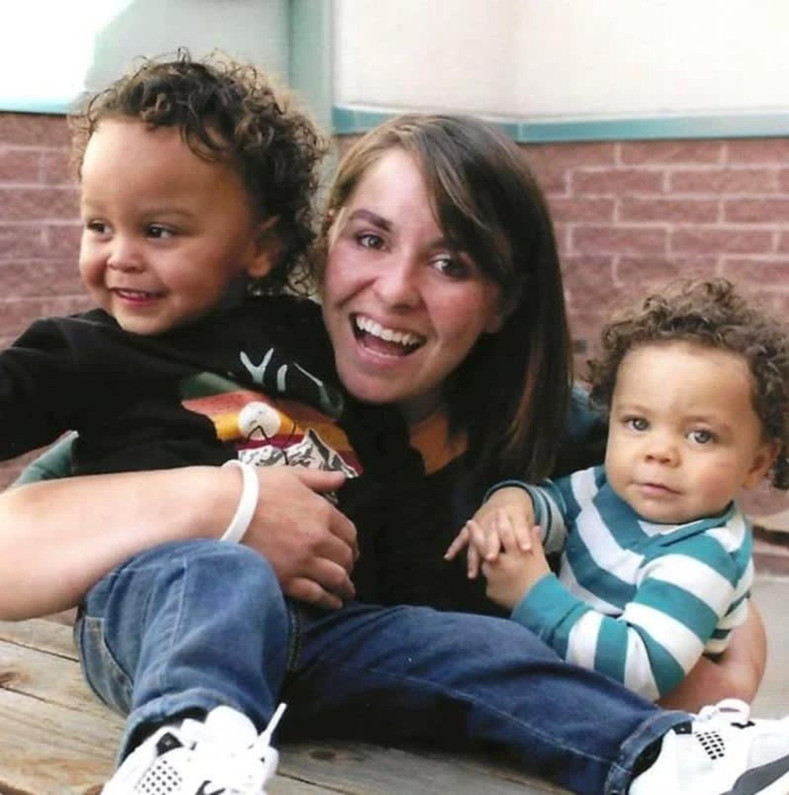 Mother smiling with her two young children