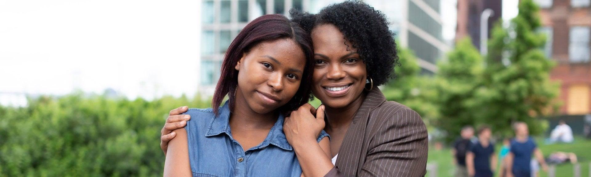 Mother and daughter portrait outdoors